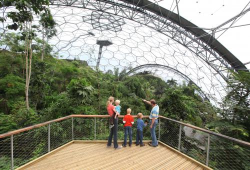 Family on a rainforest walkway in the Eden Project Rainforest Biome